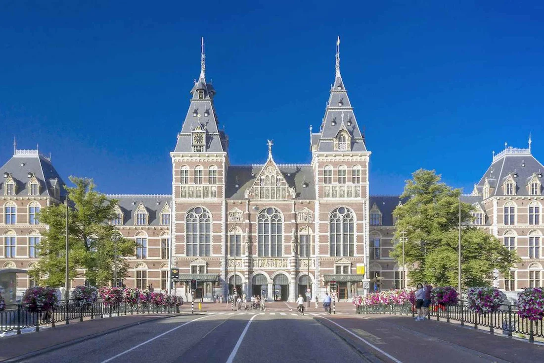 The Rijksmuseum facade across the Museumplein lawn in Amsterdam
